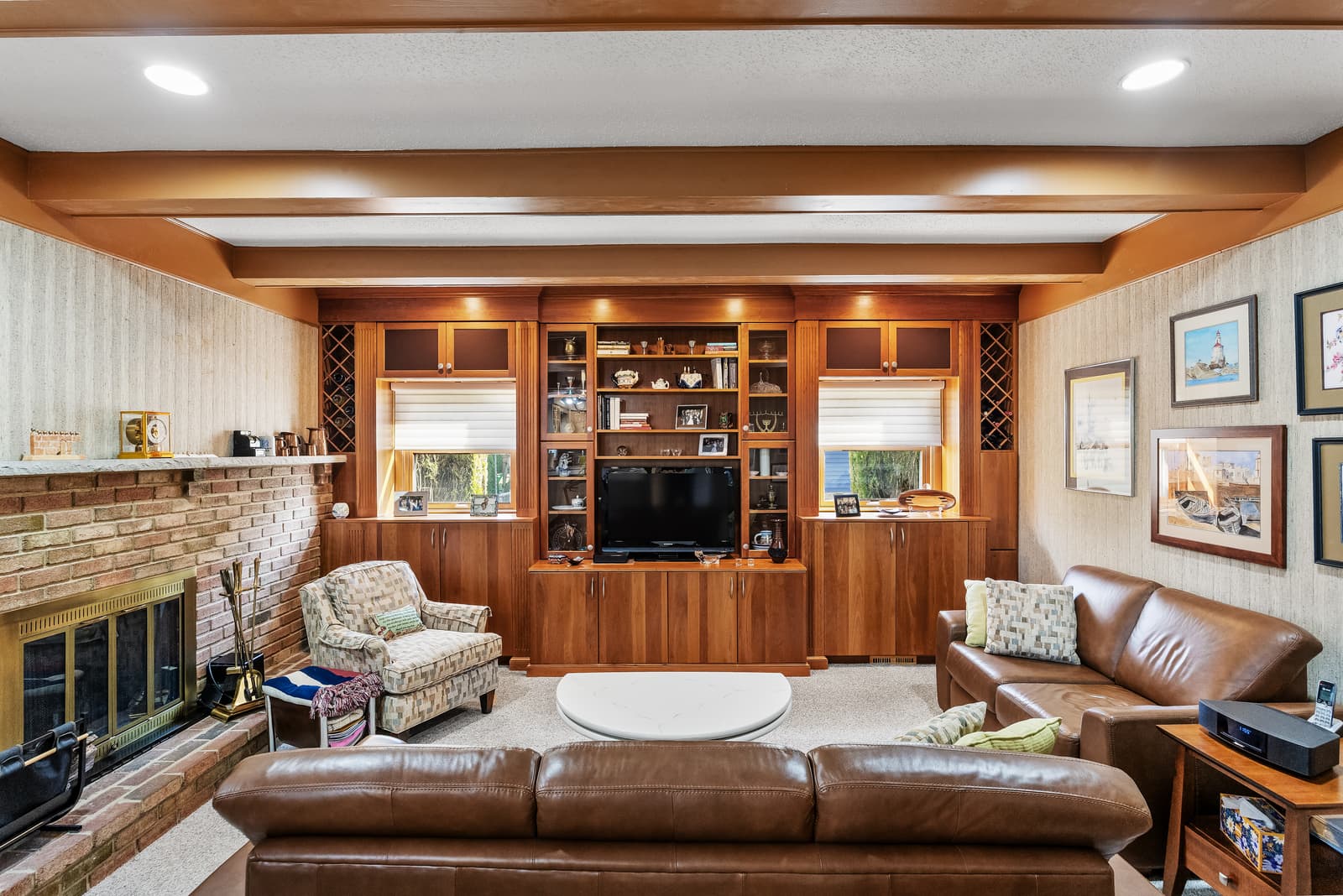 Family room with a brick fireplace and wood built-ins in Cherry Hill, NJ