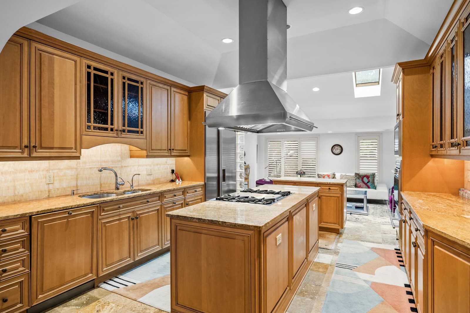 Wood kitchen with a center island and range hood in Cherry Hill, NJ