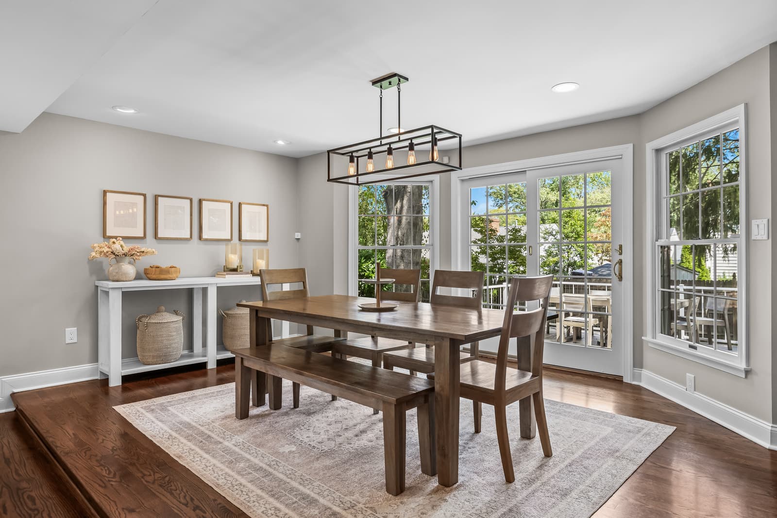 Bright dining room framed by windows in Cherry Hill, NJ