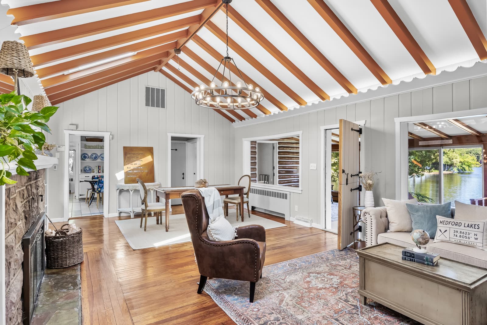 Great room with a vaulted beamed ceiling open to the kitchen in Medford, NJ