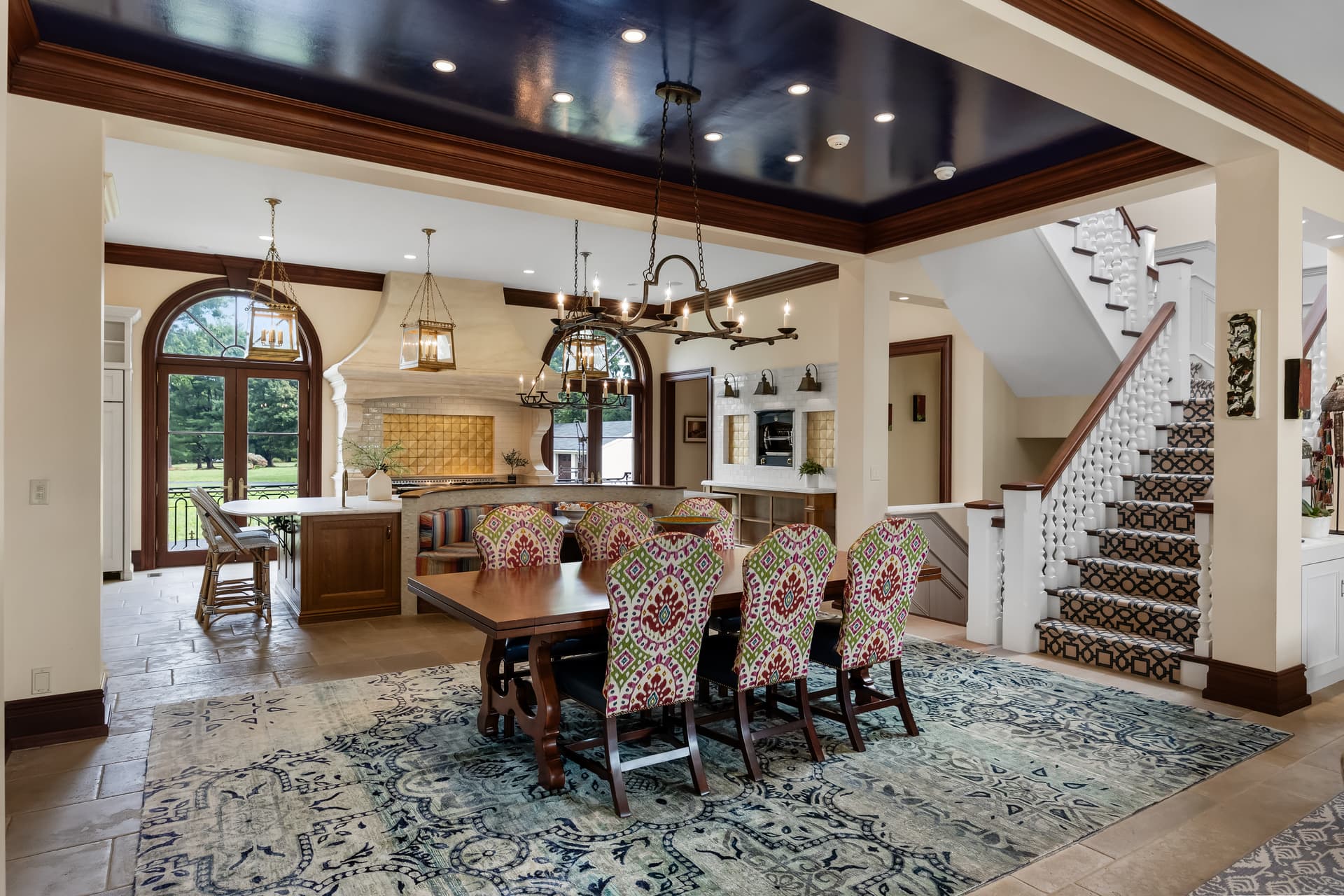 Open kitchen and dining area with a staircase in a Moorestown home