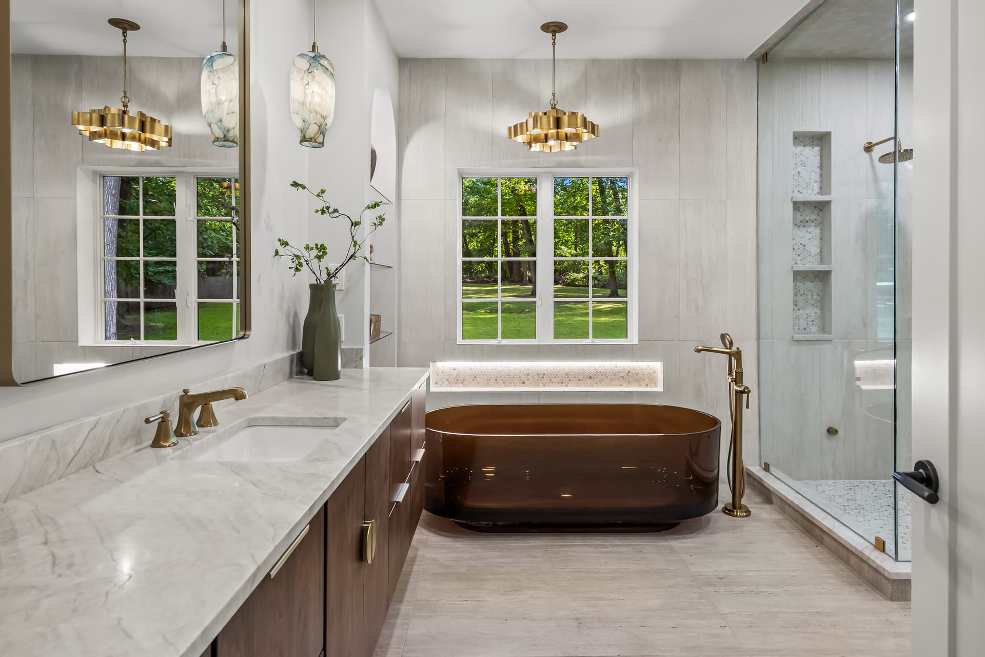 Primary bathroom with a double vanity and soaking tub in a Moorestown home