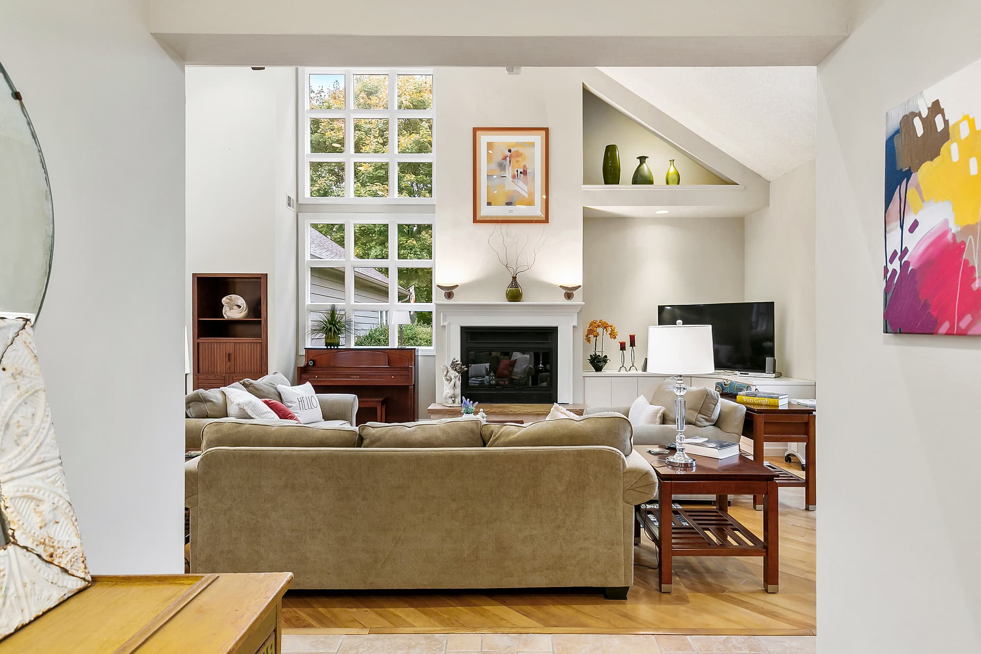 Family room with a fireplace and built-ins in a Moorestown home
