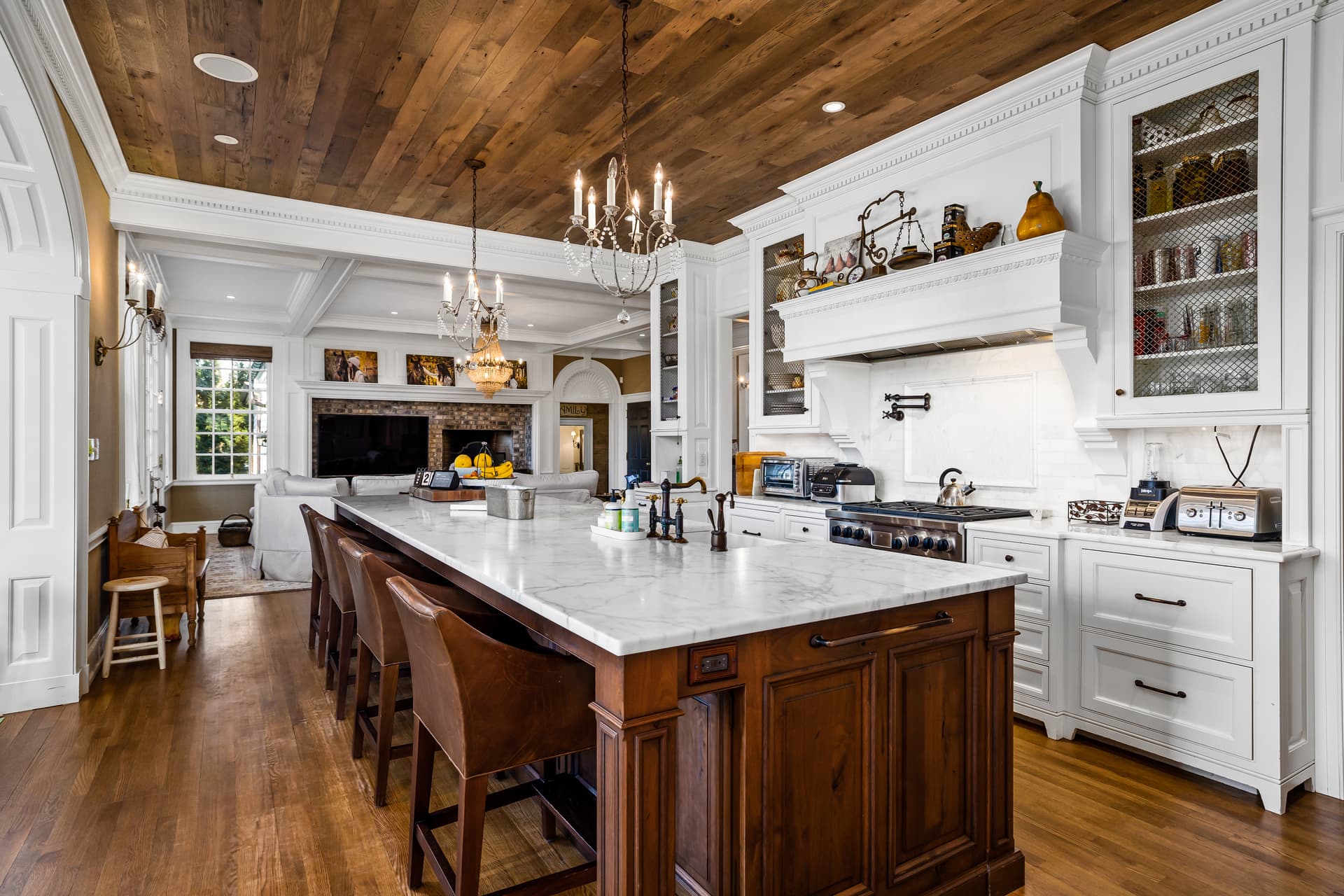 Kitchen with a walnut island and glass-front cabinets in a Moorestown home