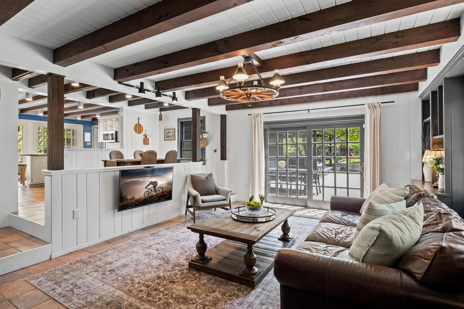 Family room with exposed beams photographed by Steve Edwards